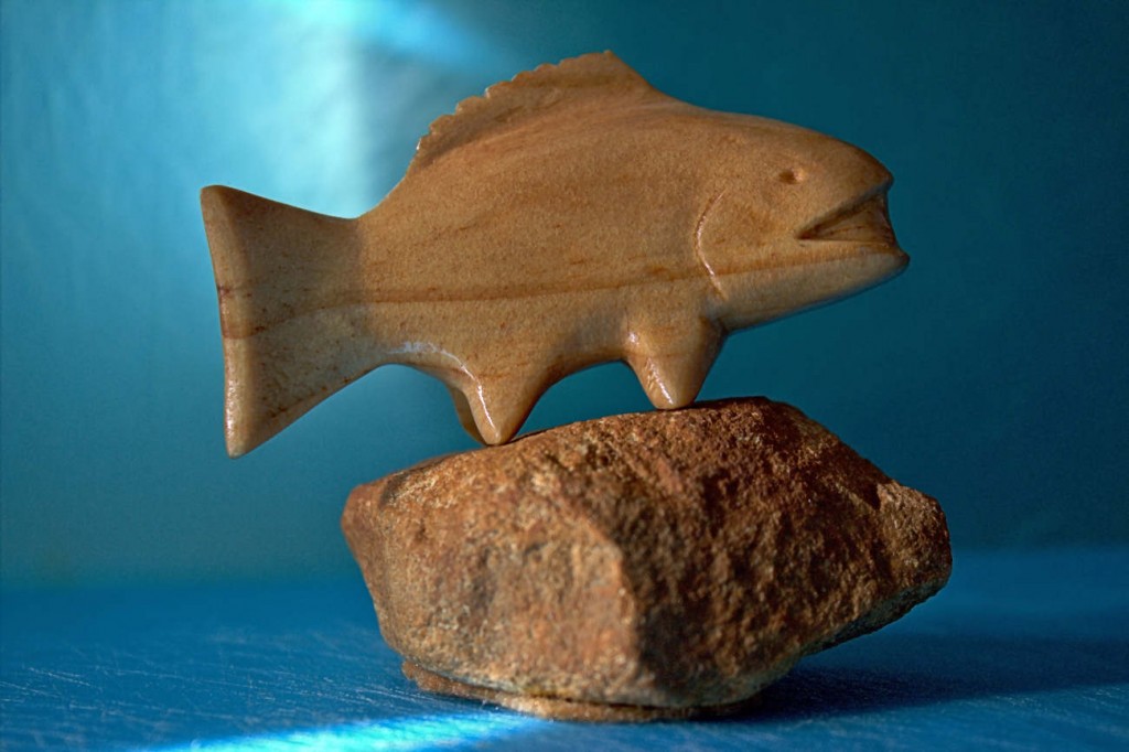 whittled small fish from wood